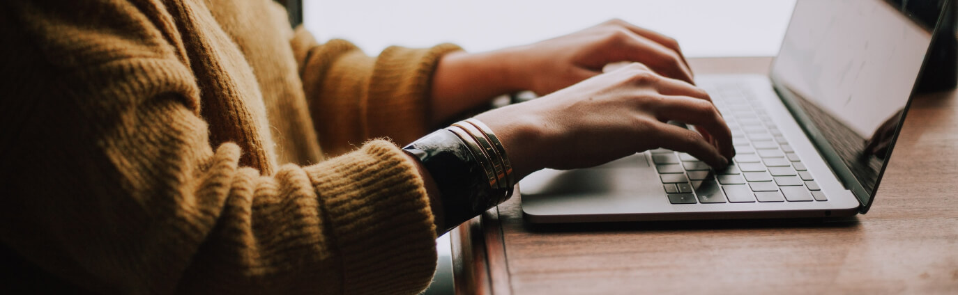 person on laptop at table