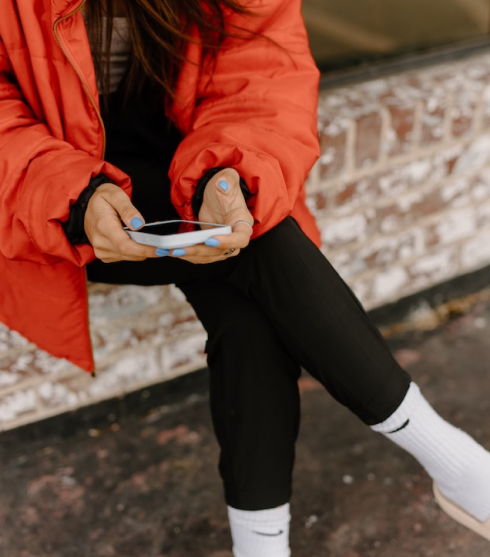 woman looking at mobile phone